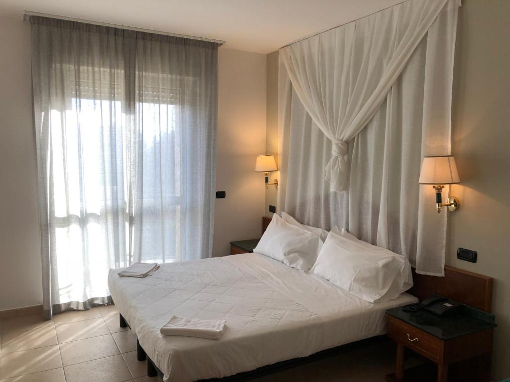 Postel nebo postele na pokoji v ubytování Ariae Dépendance - Alihotels
