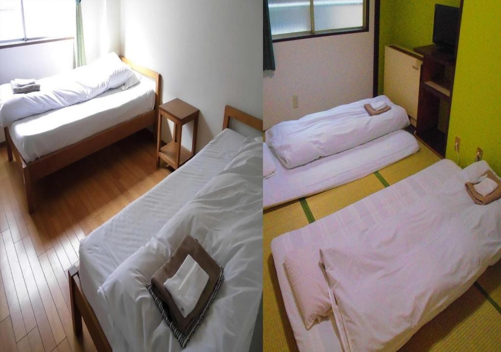 大阪市にあるOsaka - Hotel / Vacation STAY 23784のベッド2台付きの部屋、ベッドバイザー付きの部屋