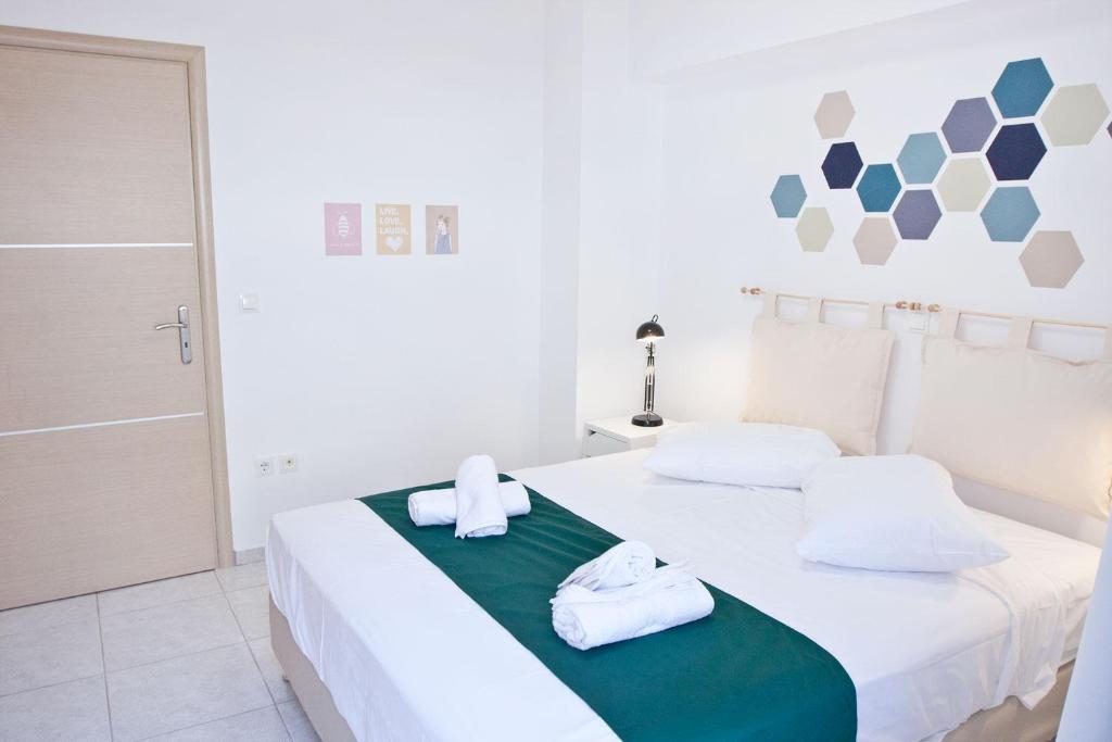 Ένα ή περισσότερα κρεβάτια σε δωμάτιο στο SilkFab Apartments