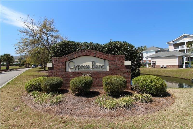 a sign for a corner lord in a yard at 113 Cypress Bend Condo in North Myrtle Beach
