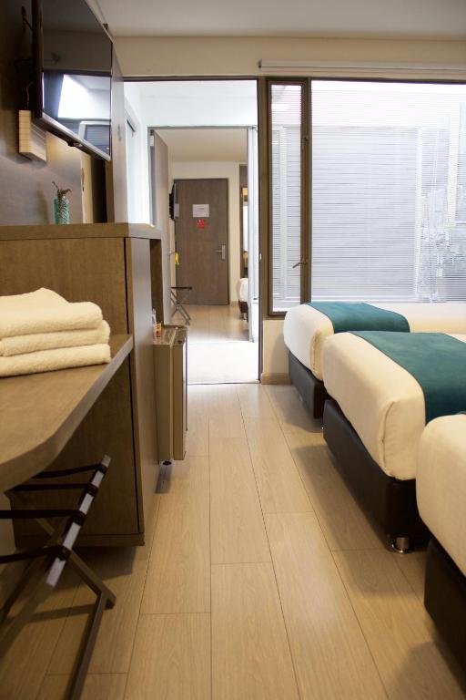 Postel nebo postele na pokoji v ubytování Agora Suites Self-Service Boutique Hotel