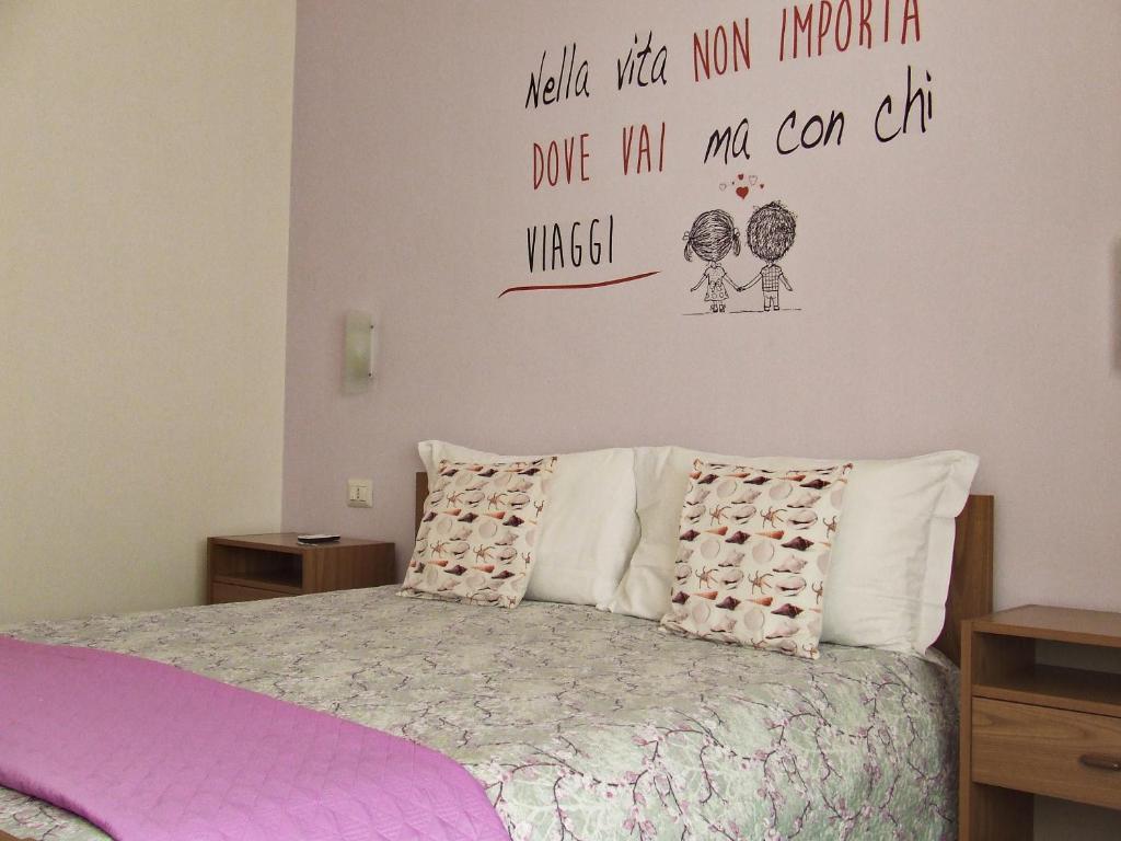 Postel nebo postele na pokoji v ubytování Leolù Guesthouse Alghero