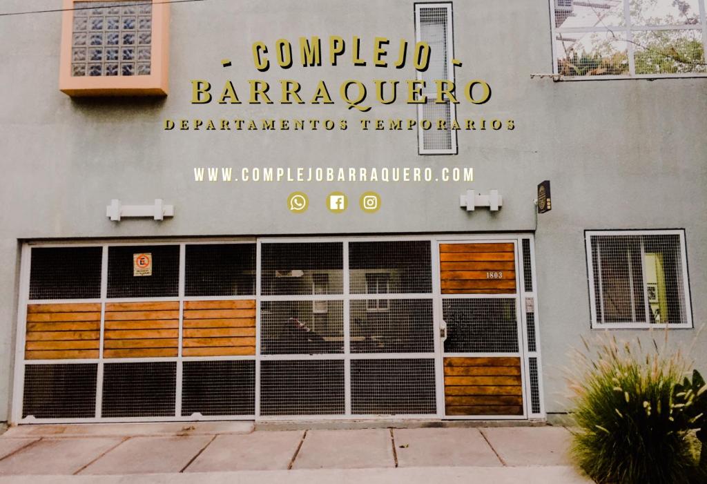 a building with a sign on the side of it at Complejo Barraquero in Mendoza