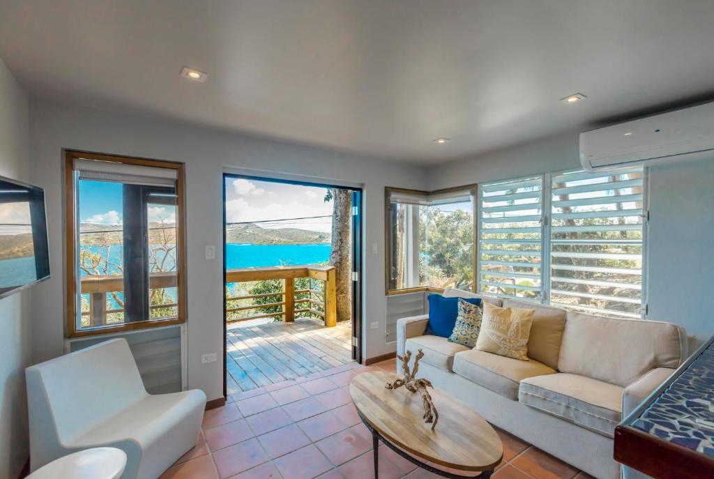 a living room with a couch and a table at Oceania Villas in Culebra