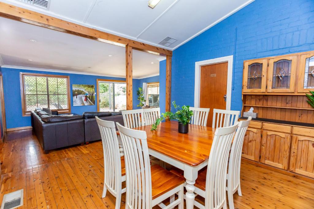 a dining room with a table and chairs at Best Central House - SLEEPS 12 !! in Wagga Wagga