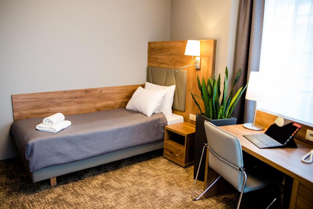 Postel nebo postele na pokoji v ubytování APART HOTEL 12