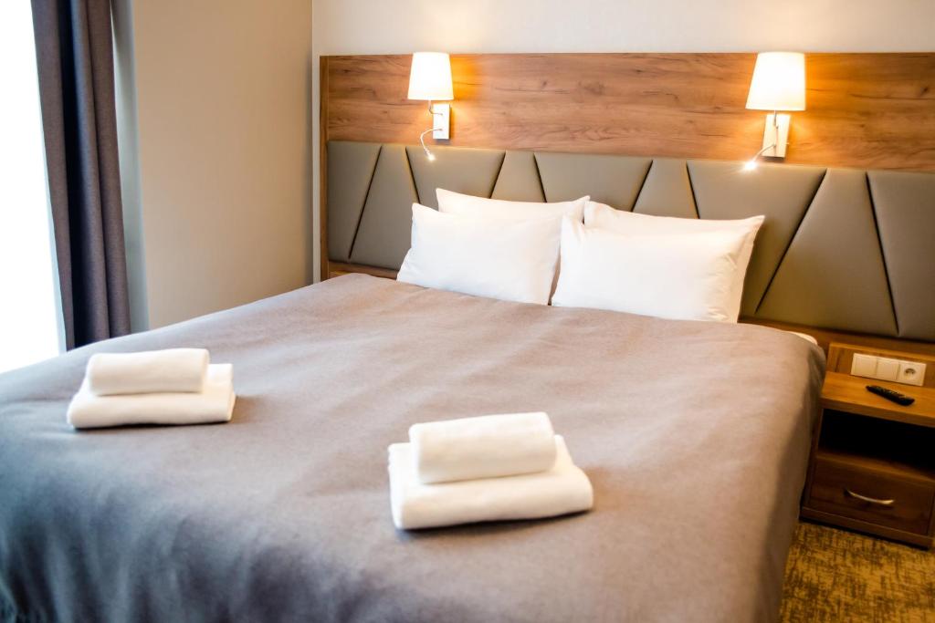 Postel nebo postele na pokoji v ubytování APART HOTEL 12
