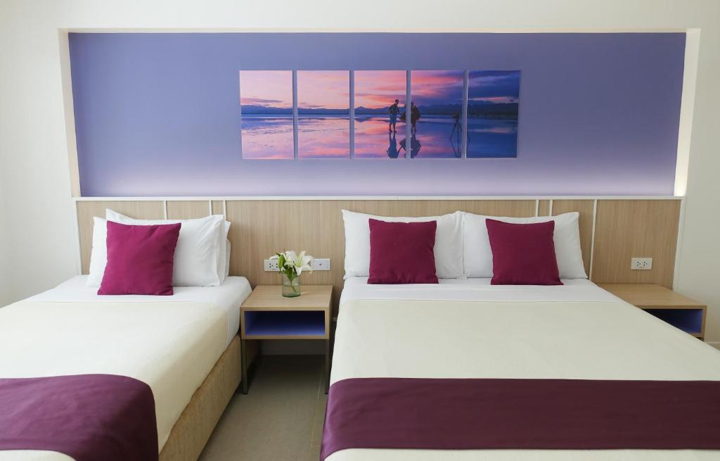 Postel nebo postele na pokoji v ubytování Patio Pacific Resort