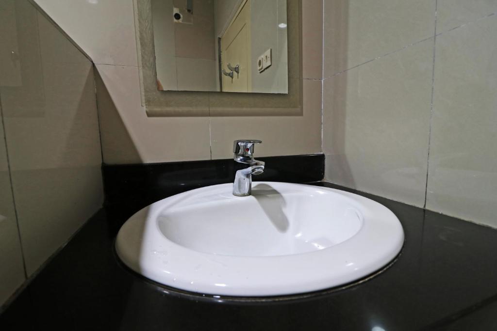 Koupelna v ubytování Hotel Sampaga