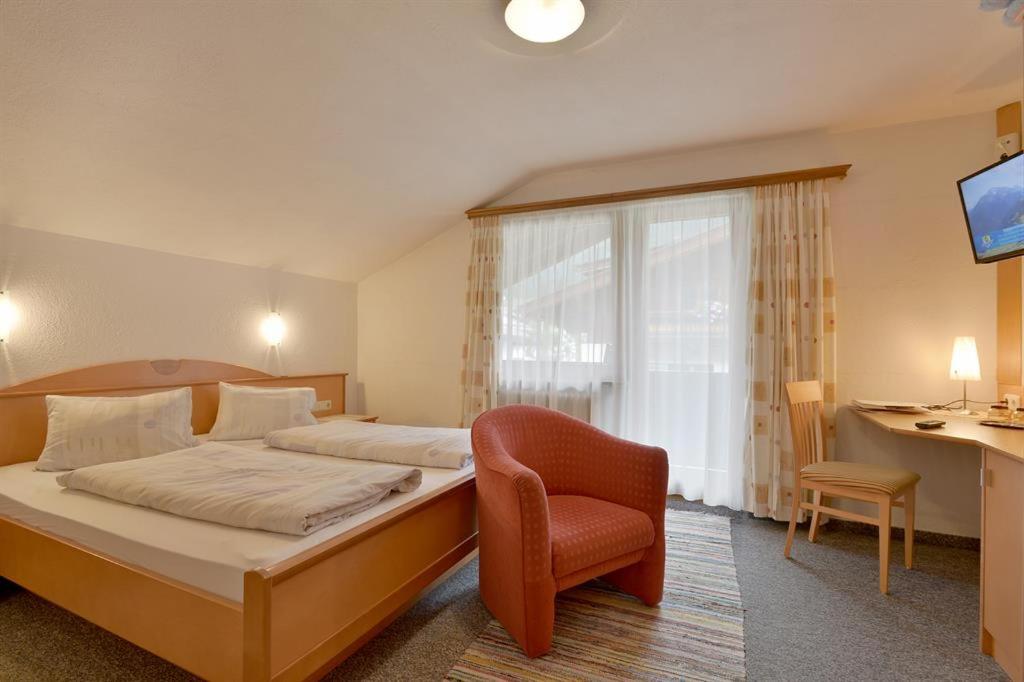 Postel nebo postele na pokoji v ubytování Gästehaus Hoamatl