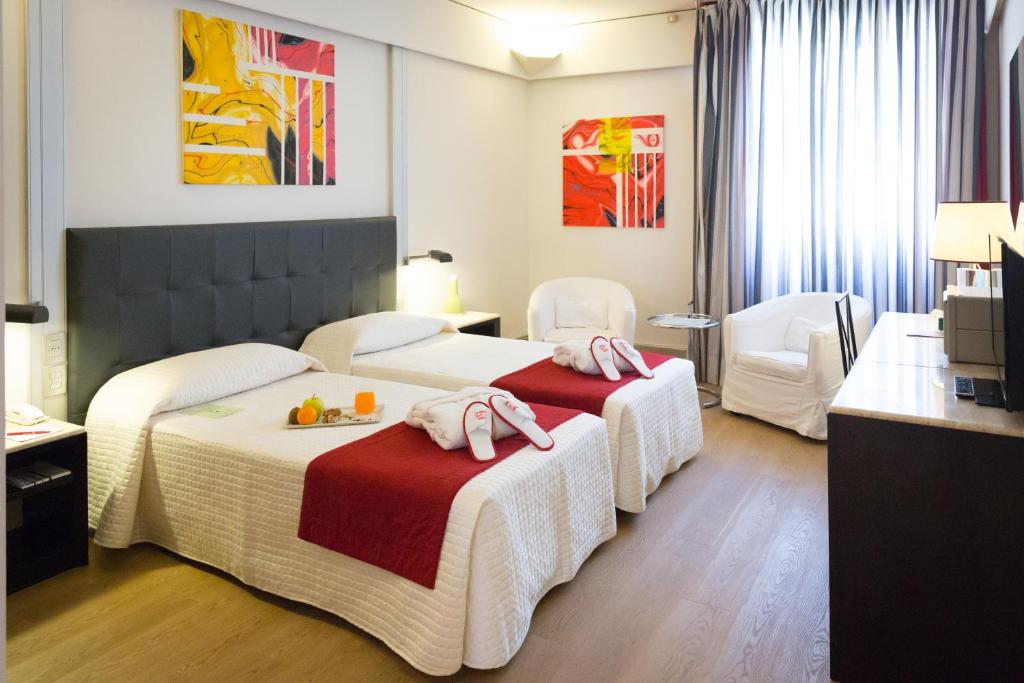 Postel nebo postele na pokoji v ubytování Art Hotel Museo