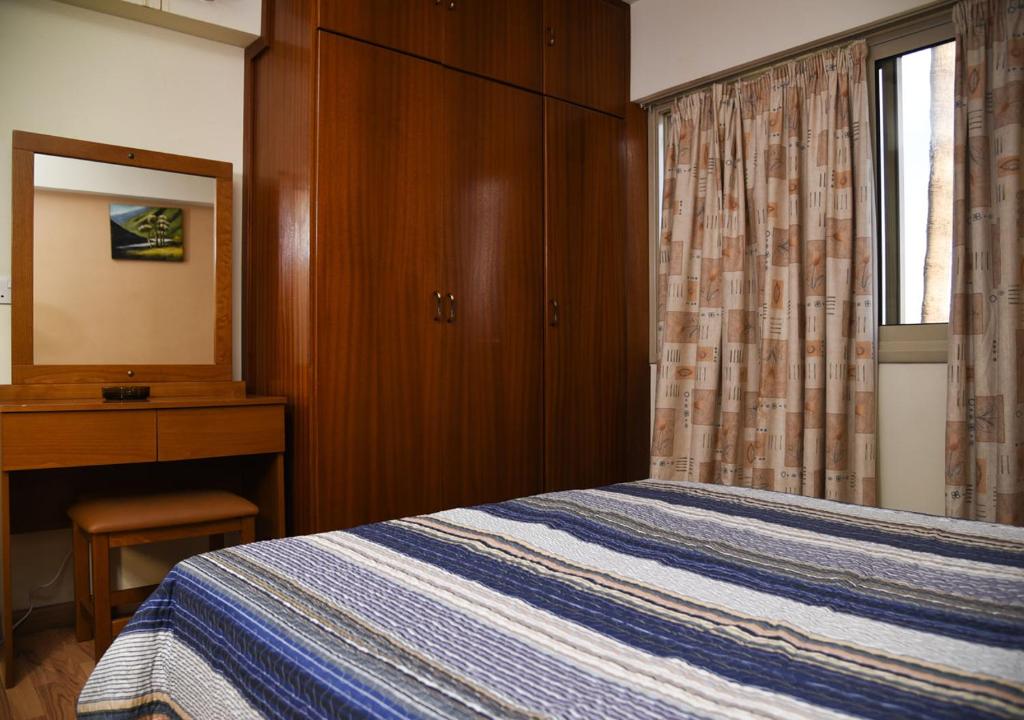 Postel nebo postele na pokoji v ubytování Elysso Hotel