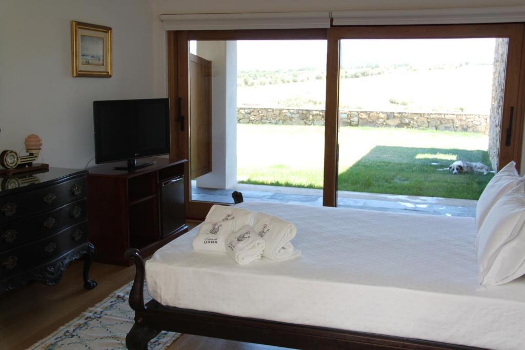 Postel nebo postele na pokoji v ubytování Casa da Urra