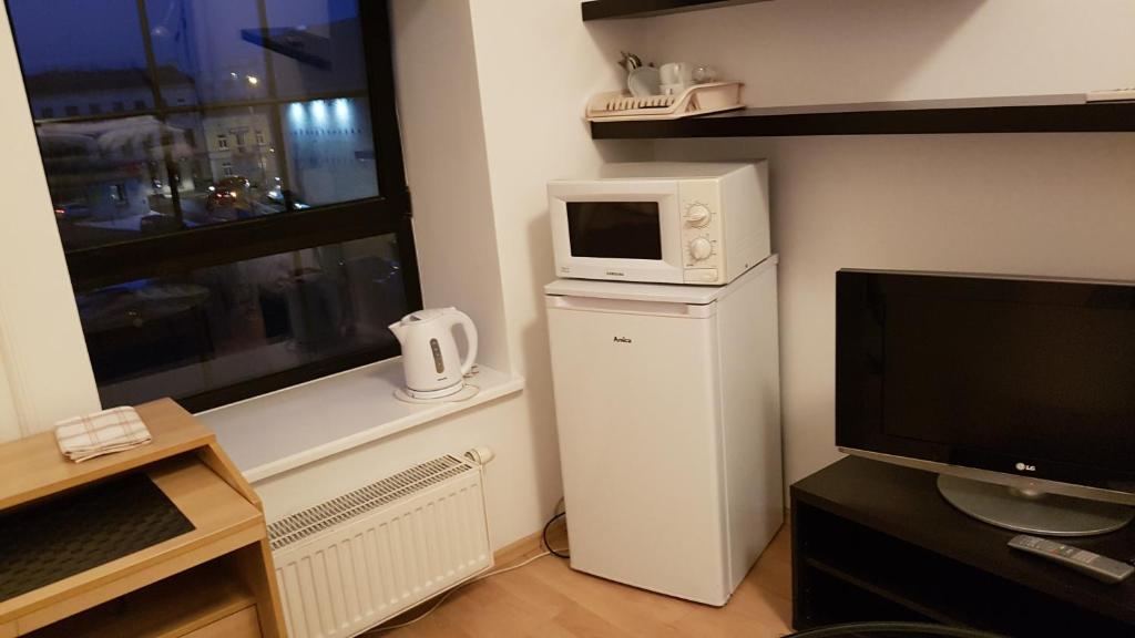 Kuchyňa alebo kuchynka v ubytovaní Apartamenty „Lofty w piecowni”