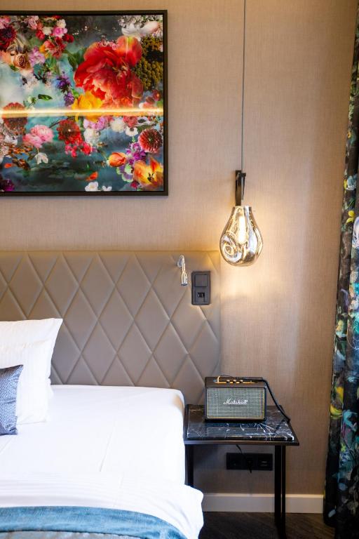 Postel nebo postele na pokoji v ubytování Boutique Hotel Poppenbütteler Hof