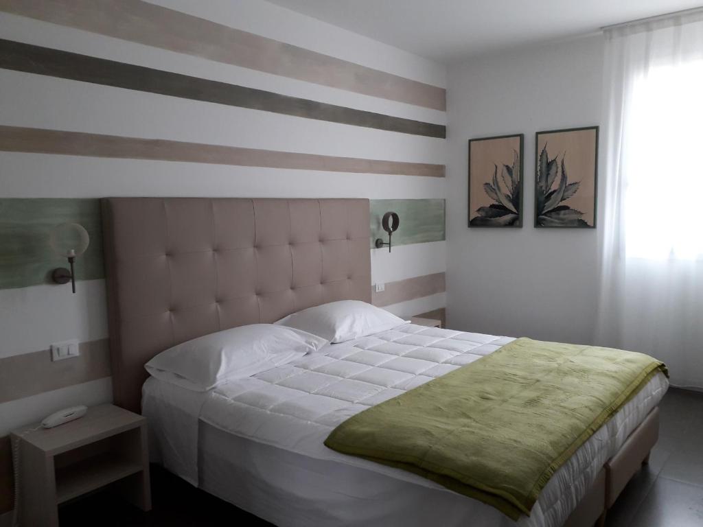 Postel nebo postele na pokoji v ubytování Hotel Grel