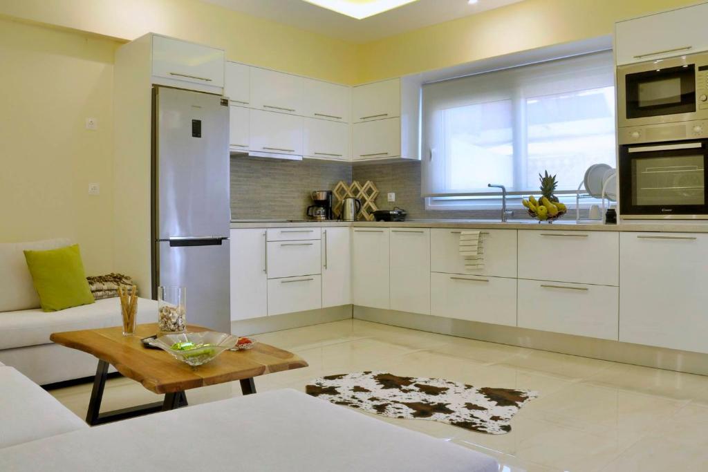 A kitchen or kitchenette at Katoi Apartment 1 Agios Georgios Pagoi