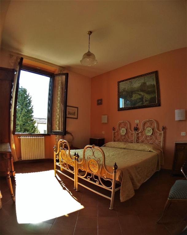 Postel nebo postele na pokoji v ubytování Hotel Merlini