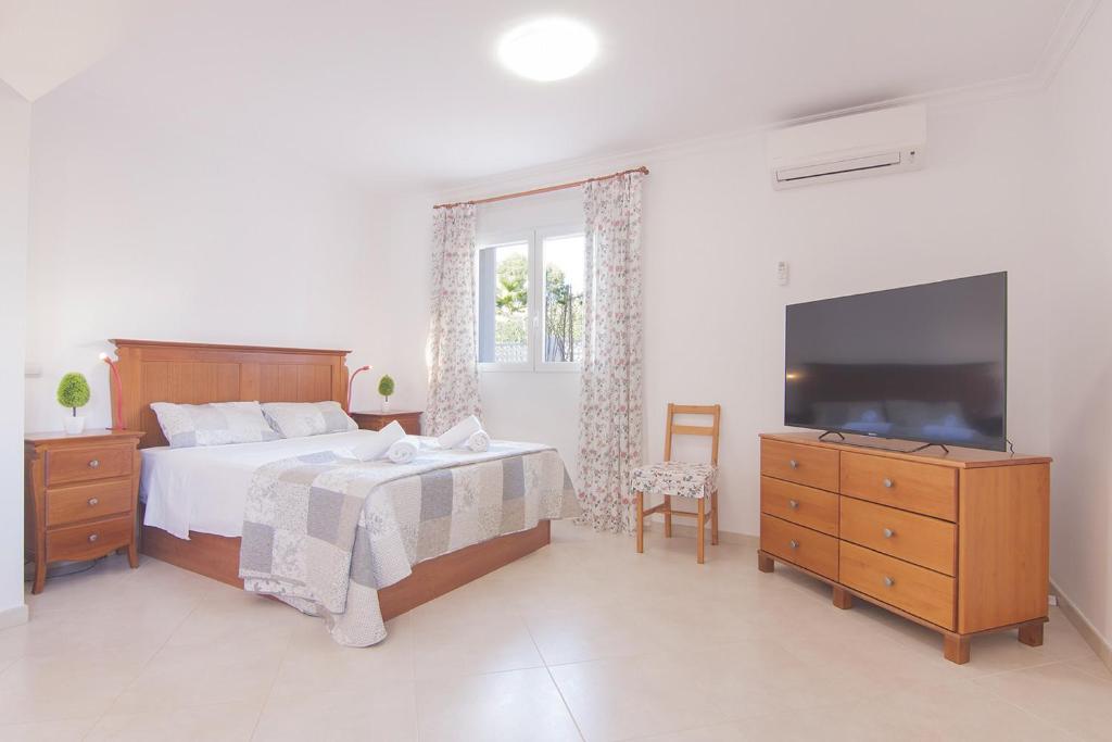 Postel nebo postele na pokoji v ubytování Villas Guzman - Soleada