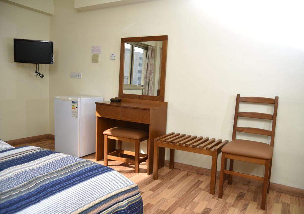 Postel nebo postele na pokoji v ubytování Elysso Hotel