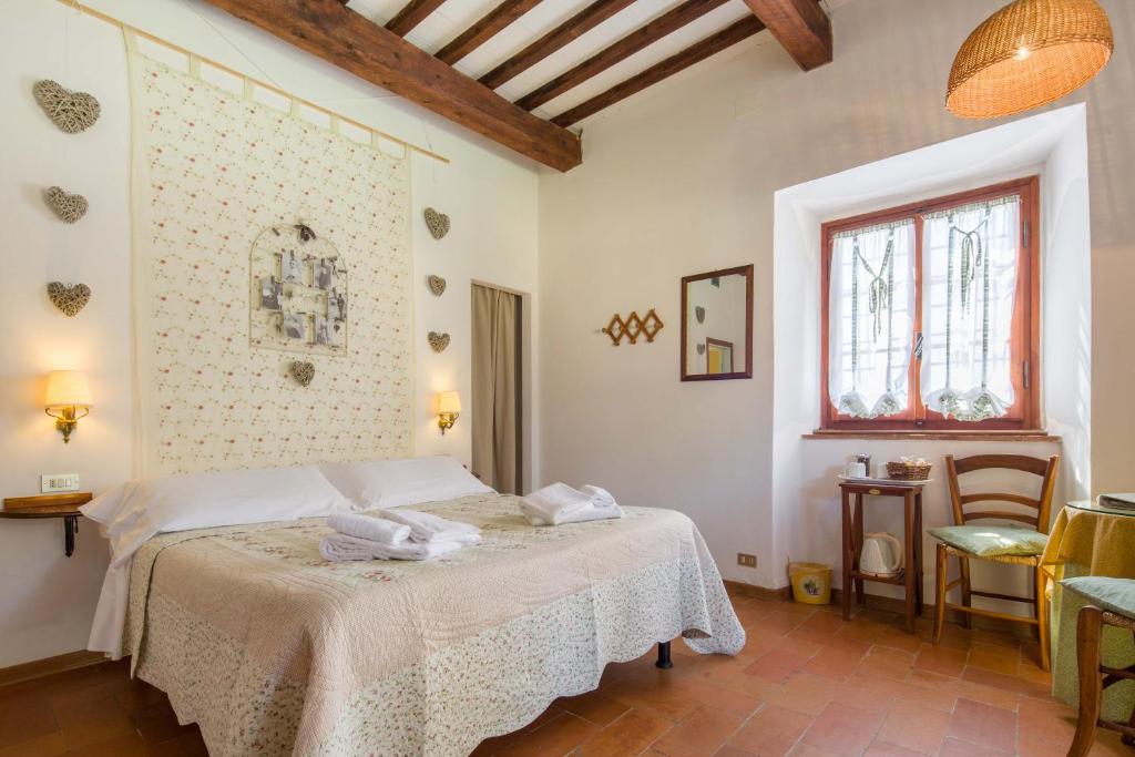 Postel nebo postele na pokoji v ubytování Ancora del Chianti
