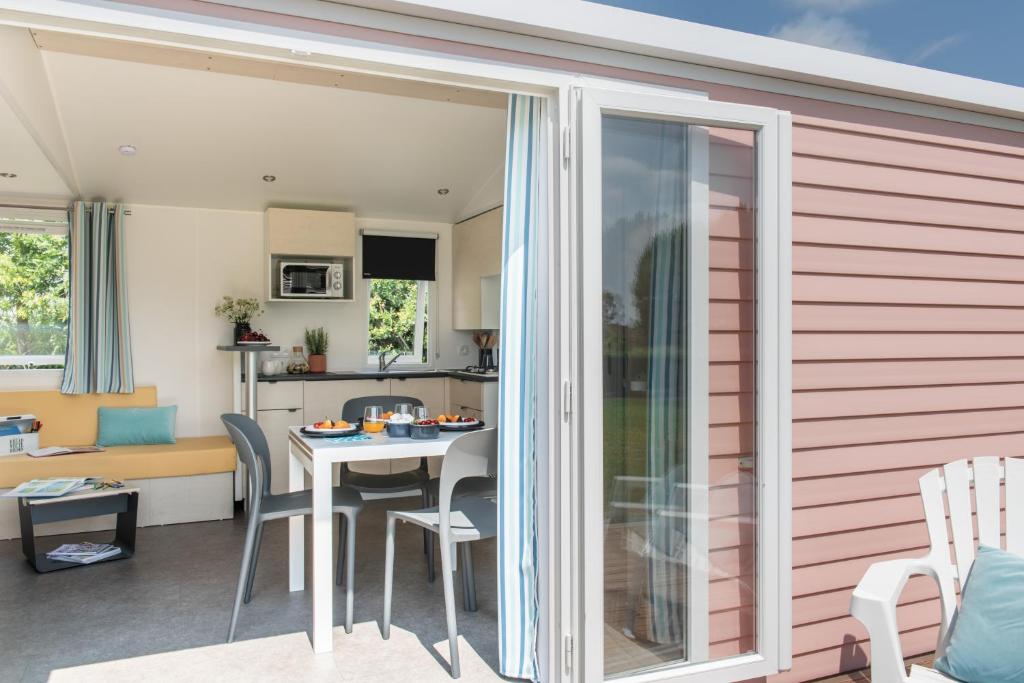 a kitchen and living room with a table and chairs at Lake Park in Berlare