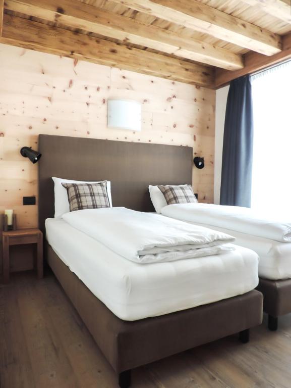 Posteľ alebo postele v izbe v ubytovaní Tilio Chalet