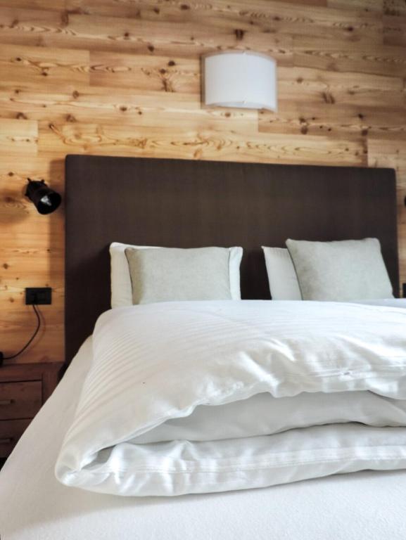 Posteľ alebo postele v izbe v ubytovaní Tilio Chalet