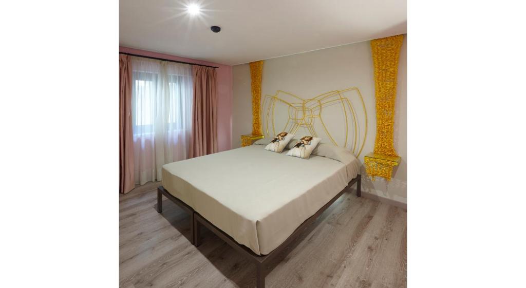 Posteľ alebo postele v izbe v ubytovaní Hotel Galería Essentia