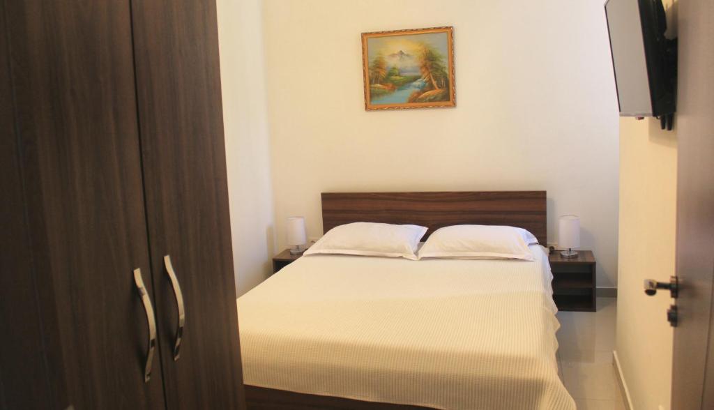 Postel nebo postele na pokoji v ubytování Hotel Kika