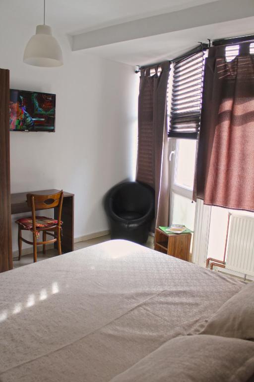 Postel nebo postele na pokoji v ubytování Hotel Kika