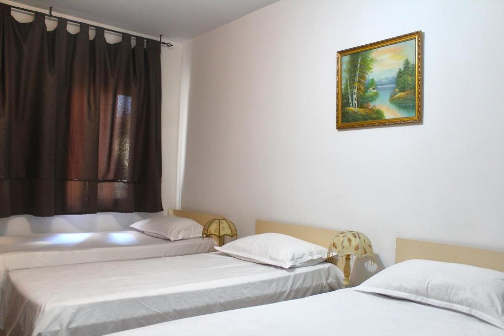 Postel nebo postele na pokoji v ubytování Hotel Kika