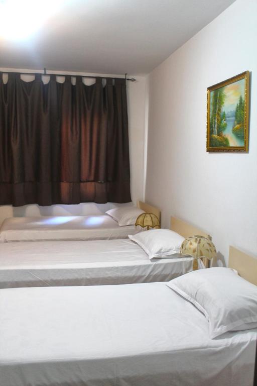 Postel nebo postele na pokoji v ubytování Hotel Kika