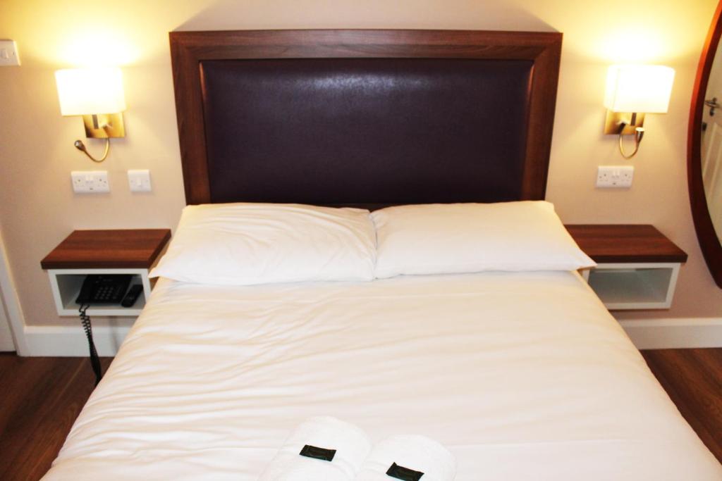 Postel nebo postele na pokoji v ubytování St. Judes Lodge B&B