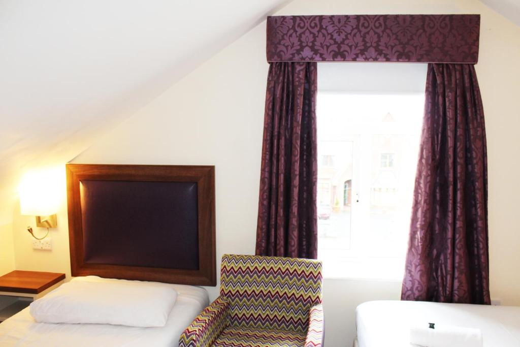 Postel nebo postele na pokoji v ubytování St. Judes Lodge B&B