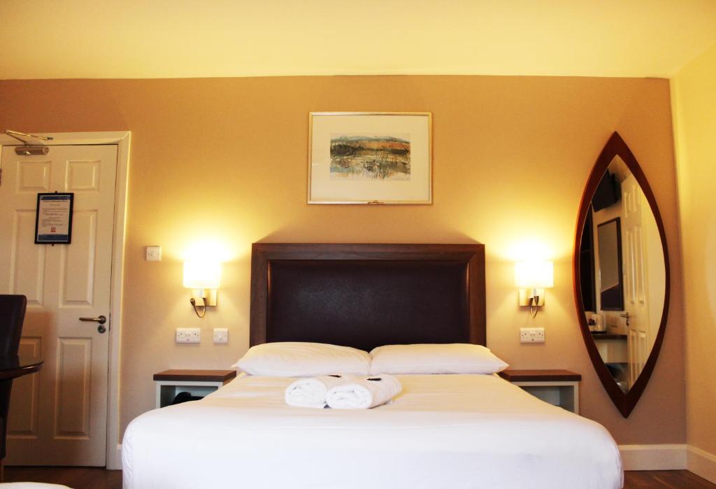 Postel nebo postele na pokoji v ubytování St. Judes Lodge B&B