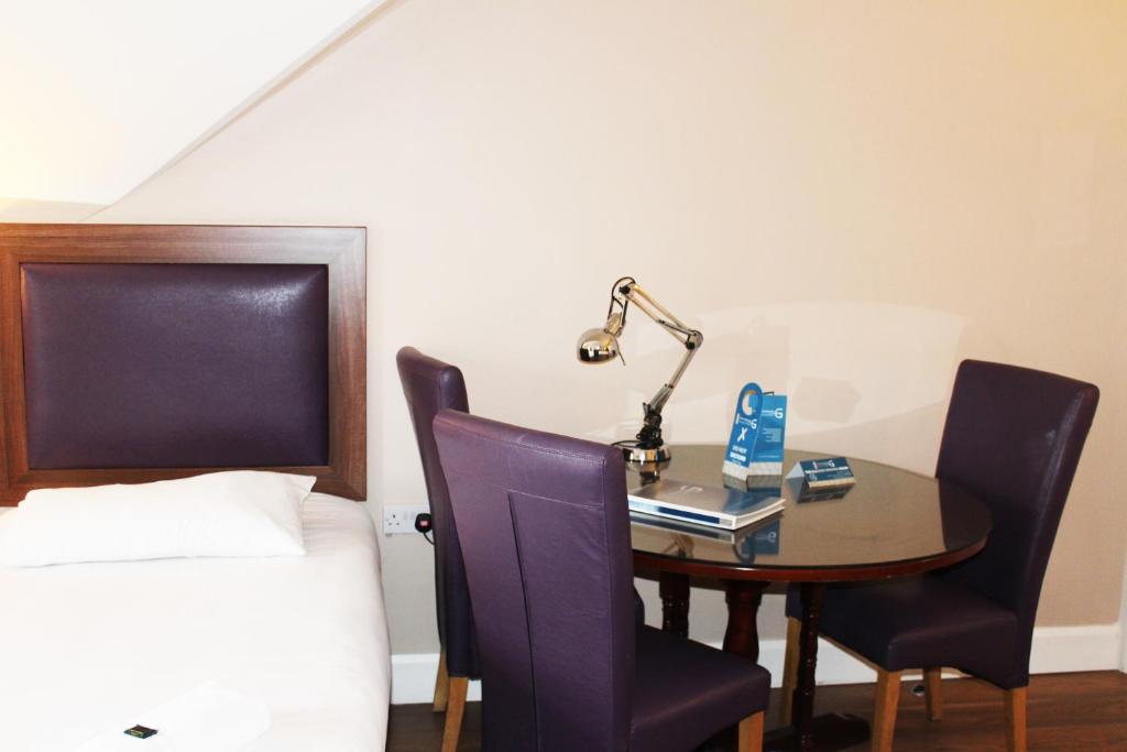 Postel nebo postele na pokoji v ubytování St. Judes Lodge B&B
