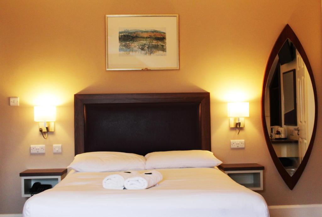 Postel nebo postele na pokoji v ubytování St. Judes Lodge B&B