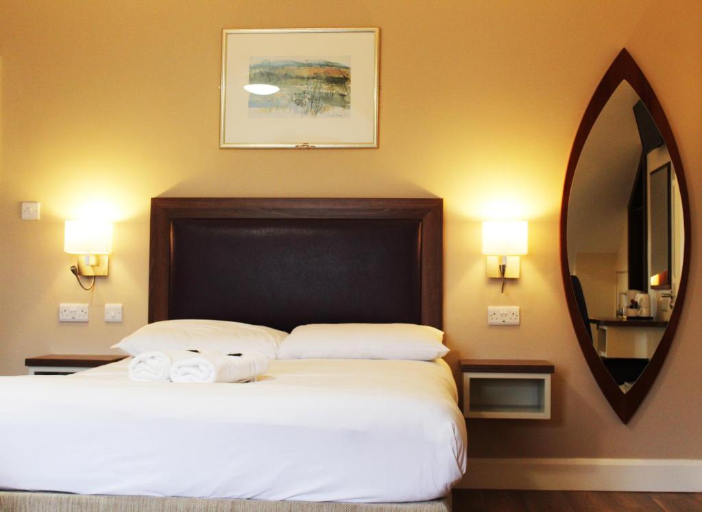 Postel nebo postele na pokoji v ubytování St. Judes Lodge B&B