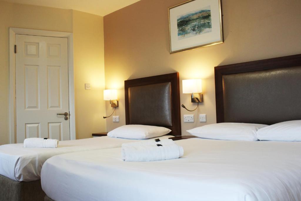 Postel nebo postele na pokoji v ubytování St. Judes Lodge B&B