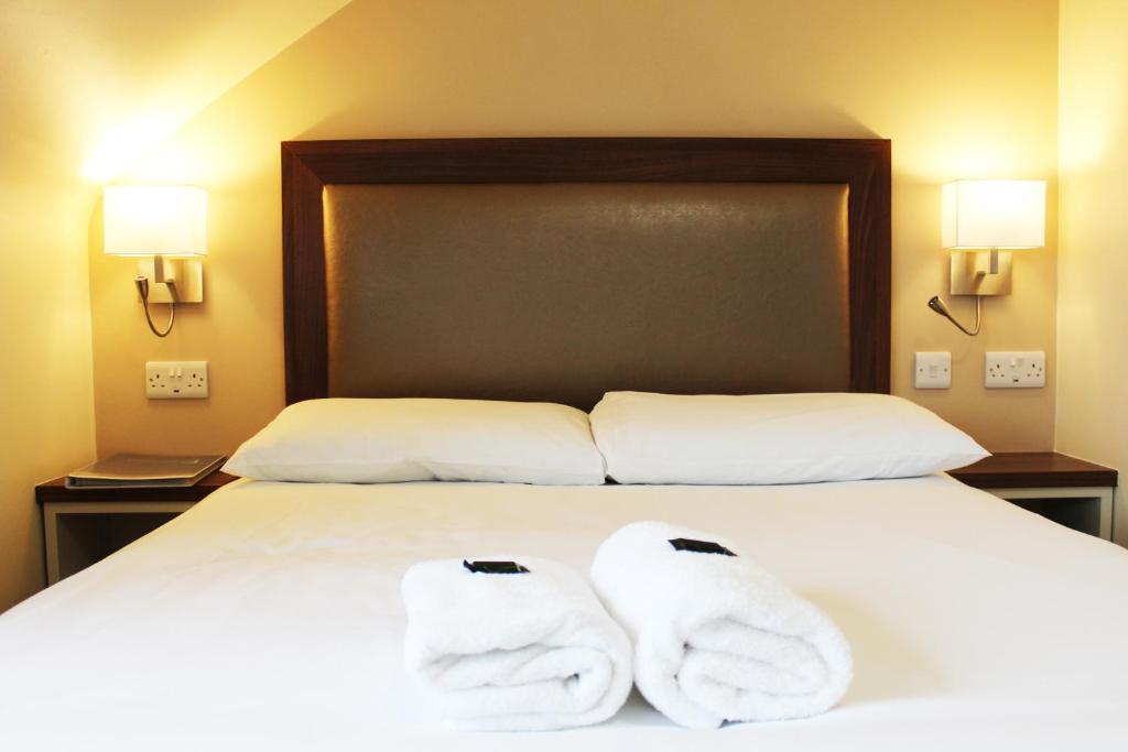 Postel nebo postele na pokoji v ubytování St. Judes Lodge B&B