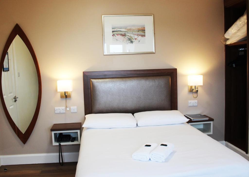 Postel nebo postele na pokoji v ubytování St. Judes Lodge B&B