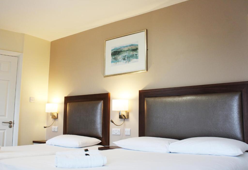 Postel nebo postele na pokoji v ubytování St. Judes Lodge B&B