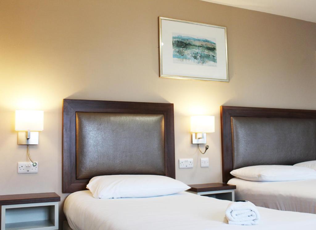 Postel nebo postele na pokoji v ubytování St. Judes Lodge B&B