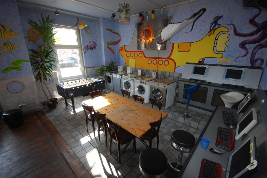 an overhead view of a kitchen with a table in a room at Sunflower Hostel Berlin in Berlin