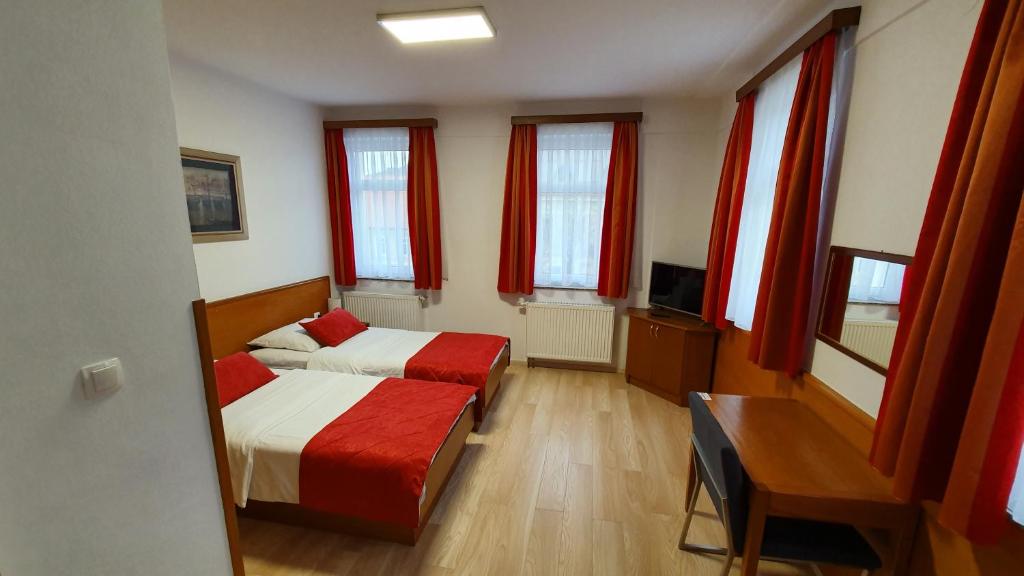Postel nebo postele na pokoji v ubytování Hotel Zvonimir