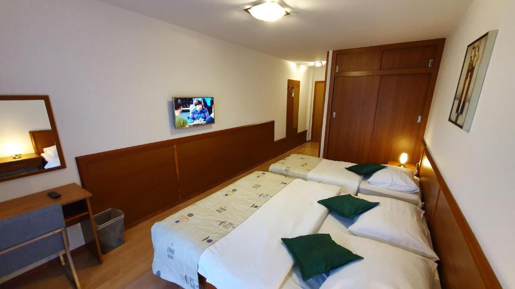 Postel nebo postele na pokoji v ubytování Hotel Zvonimir