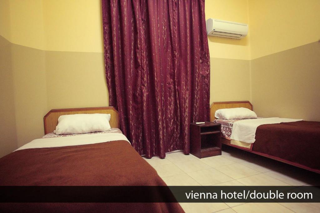 Postel nebo postele na pokoji v ubytování Hostel Vienna