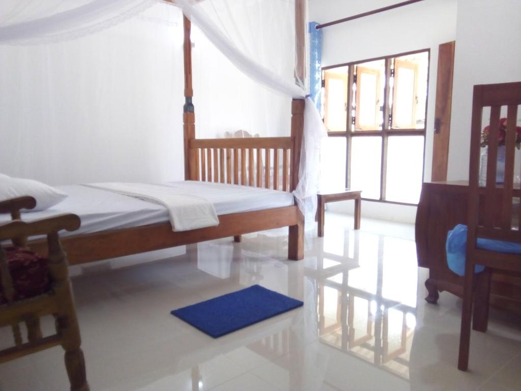 Postel nebo postele na pokoji v ubytování T & U Homestay