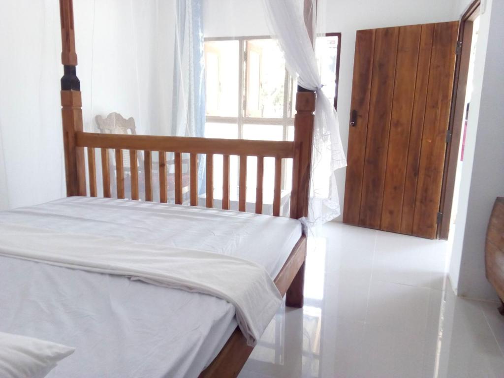 Postel nebo postele na pokoji v ubytování T & U Homestay